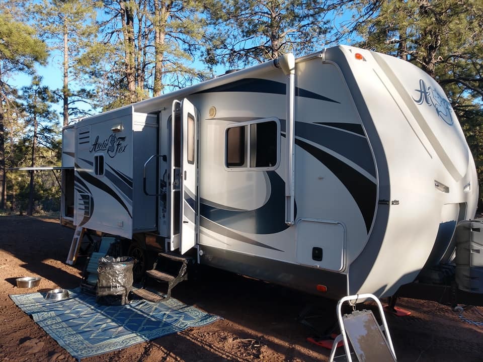 Arctic Fox 28F at campsite showing full exterior length