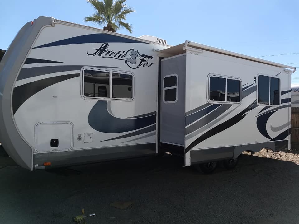 Arctic Fox 28F front cap with Arctic Fox logo and awning open