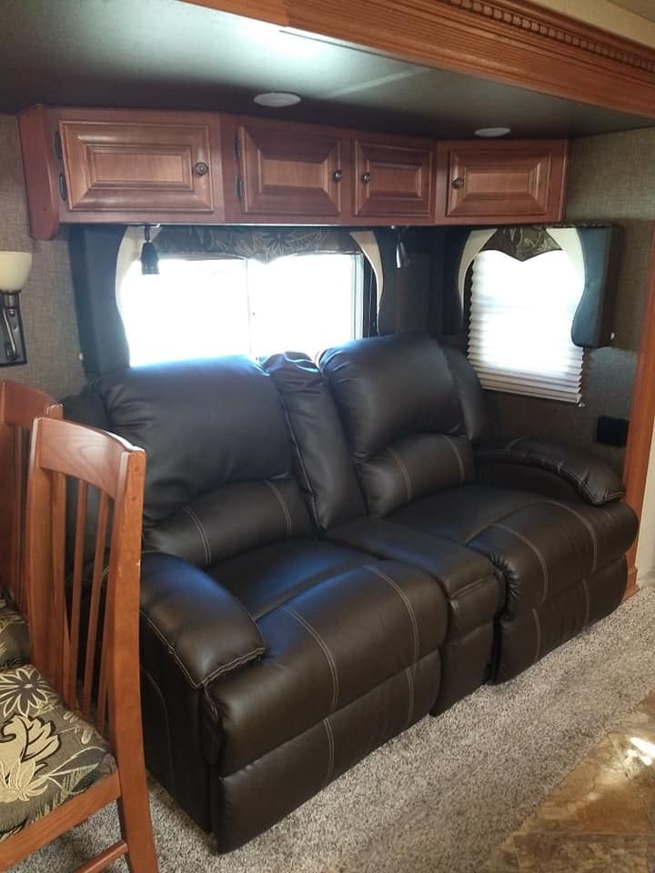 Arctic Fox 28F black leather reclining sofa with wood overhead cabinets