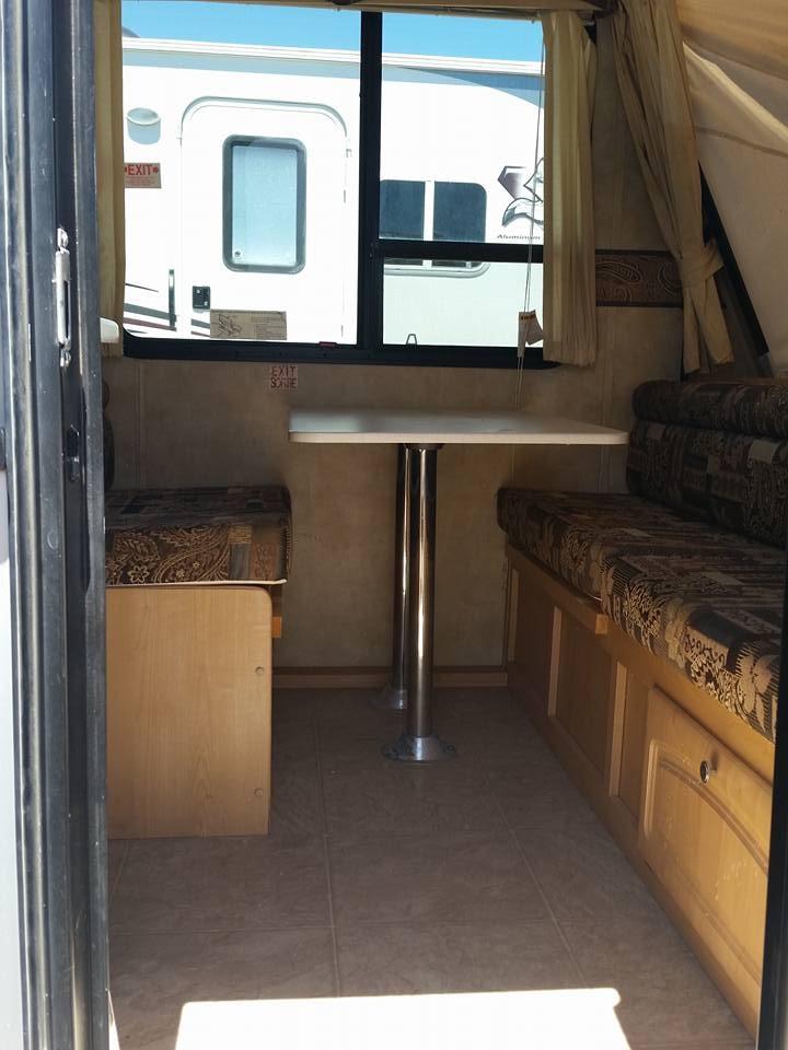 Starstream interior dinette with pedestal table and bench seating