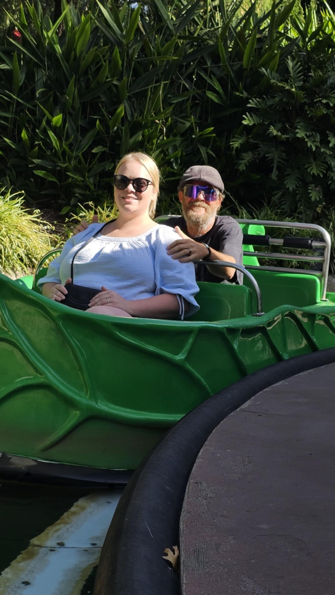 Shelby and Ben riding the LEGOLAND boat ride through the jungle waterway in Carlsbad California