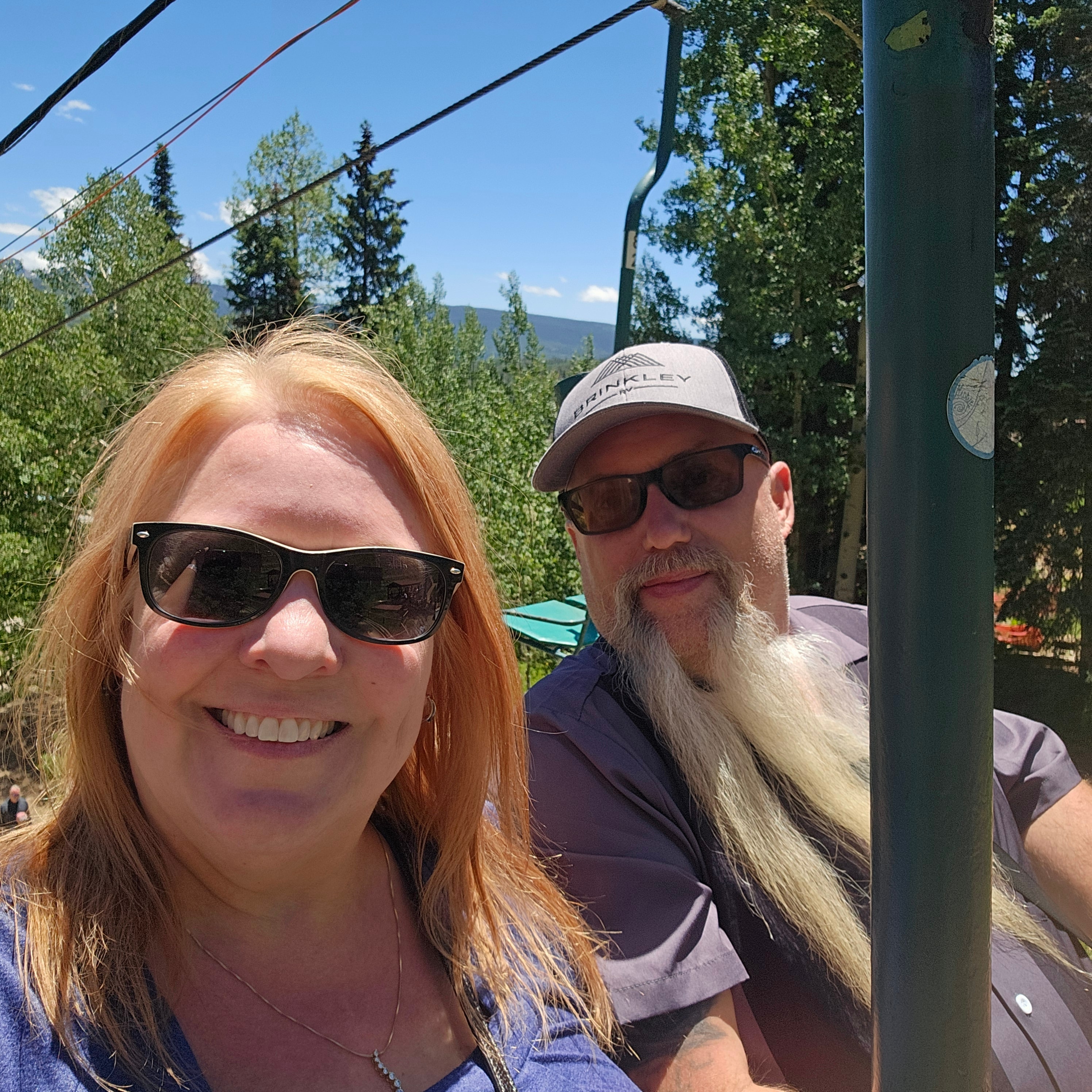 Joe and Tina selfie on the Purgatory chairlift — Brinkley cap, San Juan Mountains and aspen forest behind — LOVING LIFE HAVING FUN Brinkley Z3400