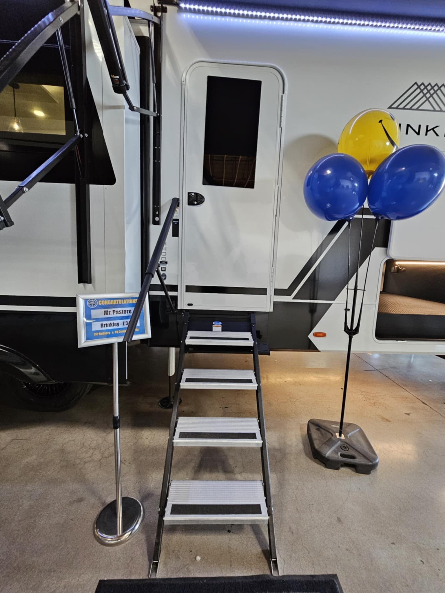 Brinkley Z3400 entry stairs with Congratulations sign and blue and yellow balloons
