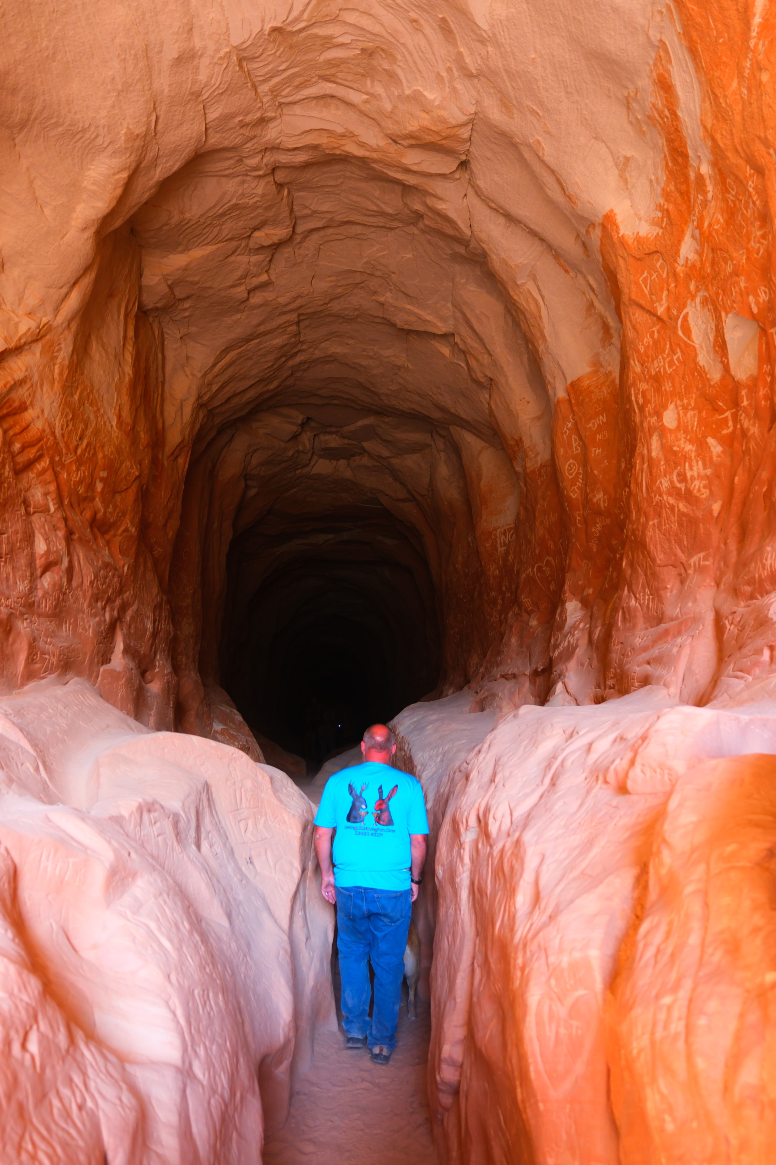Joe at the Belly of the Dragon tunnel entrance looking into the dark spiral Utah
