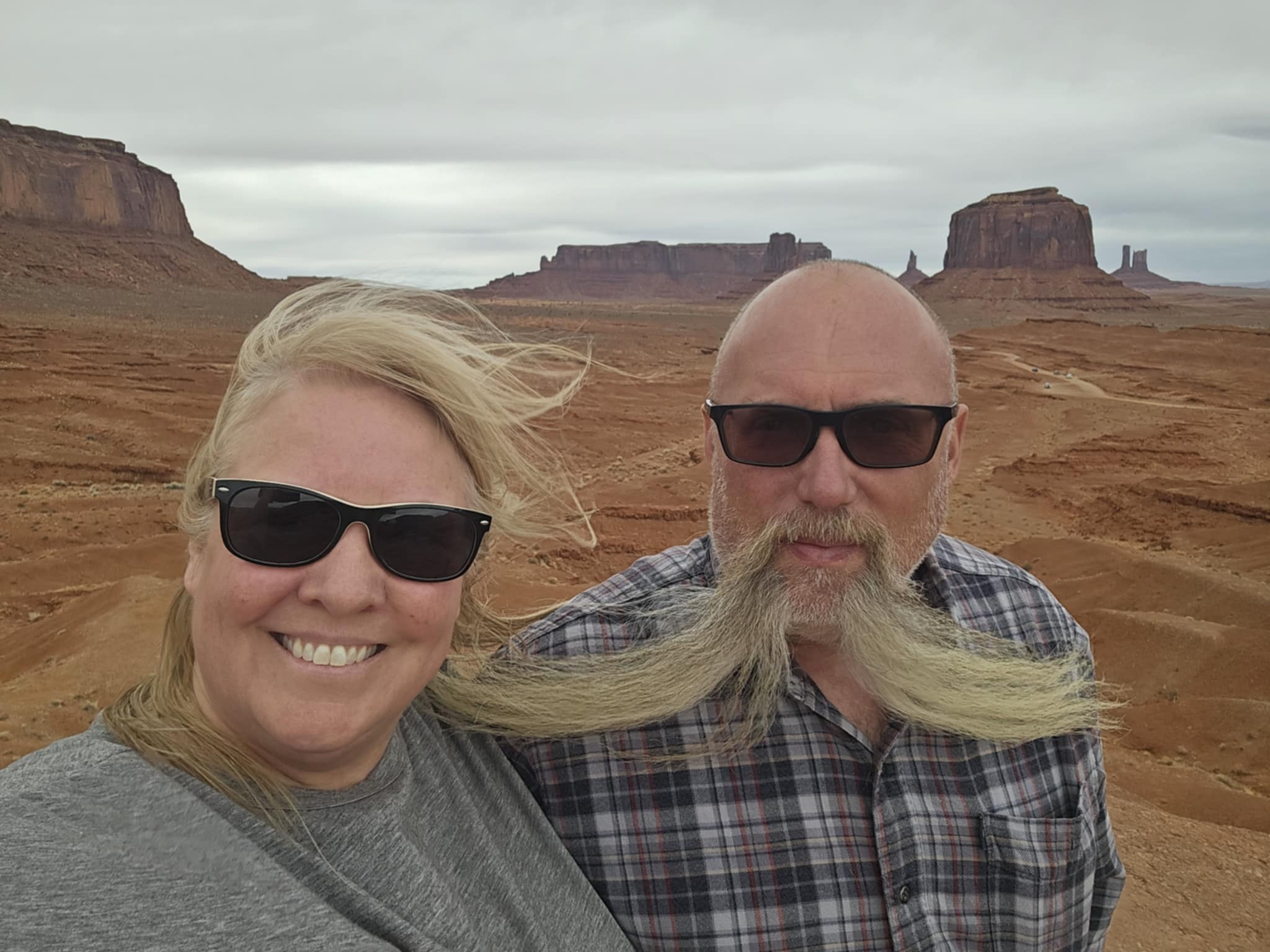 Joe and Tina selfie with the Mittens behind them, Monument Valley