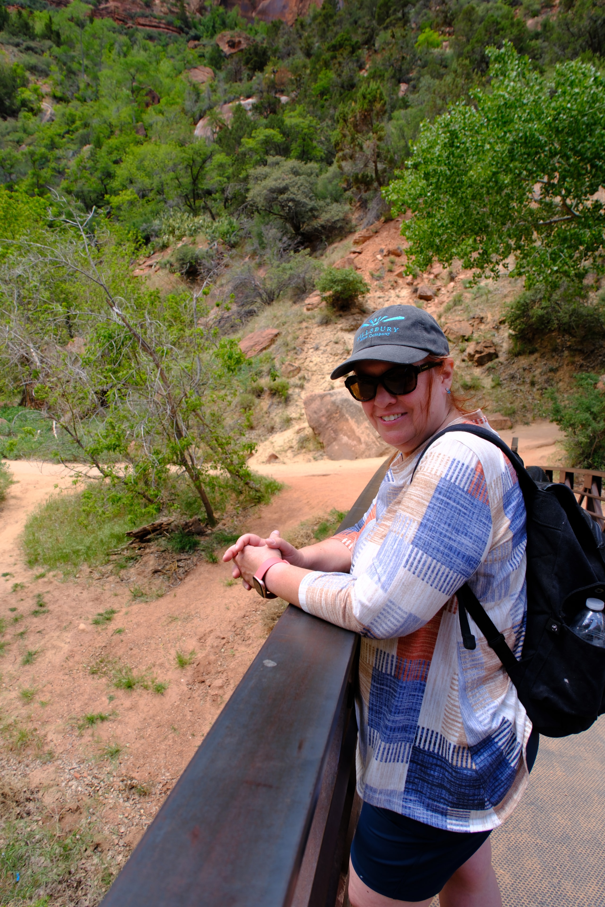 Tina on the Angels Landing chains with the canyon dropping away far below portrait at Zion National Park Utah LOVING LIFE HAVING FUN Brinkley Z3400