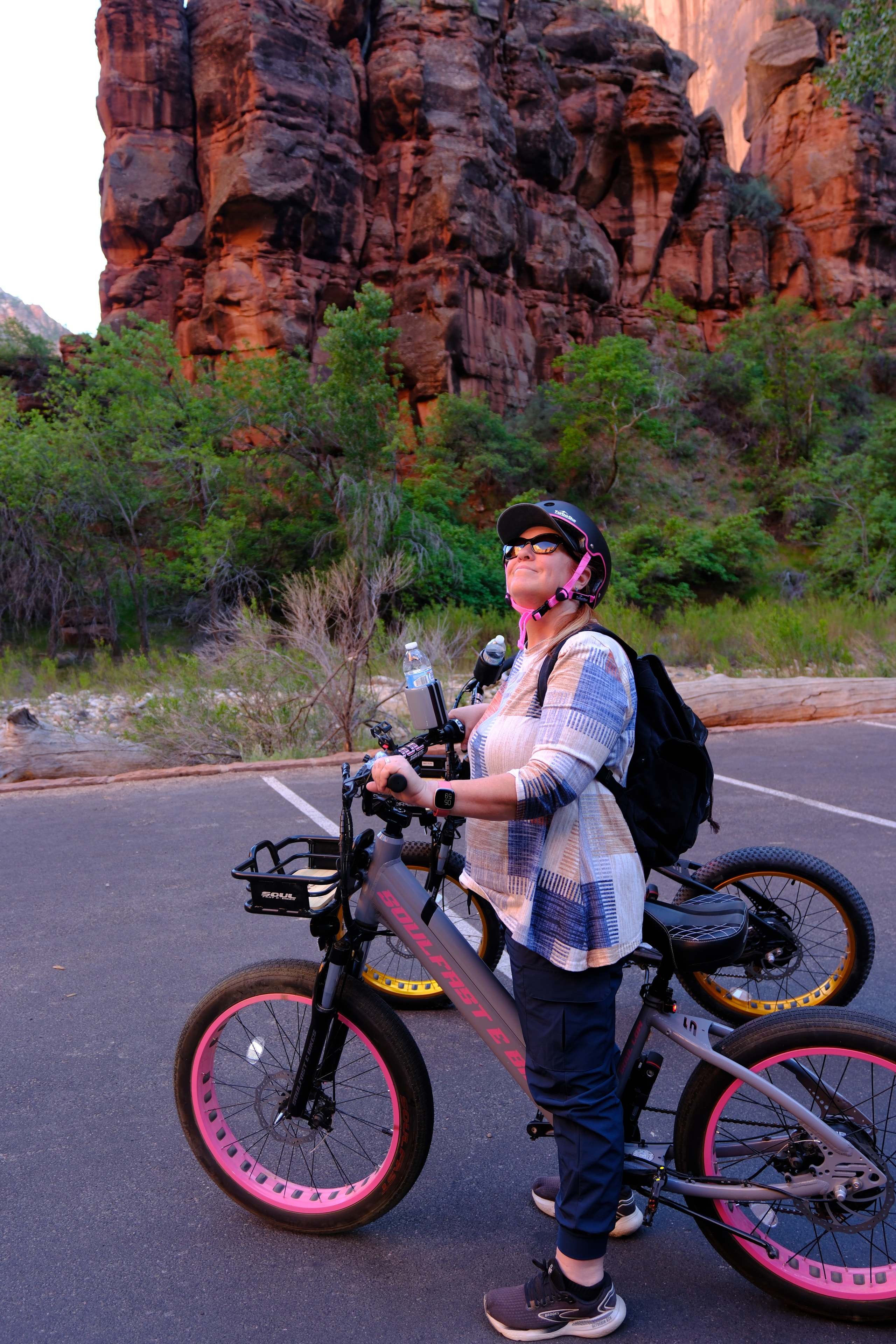 Tina riding a Soul Fast e-bike along a canyon road at Zion