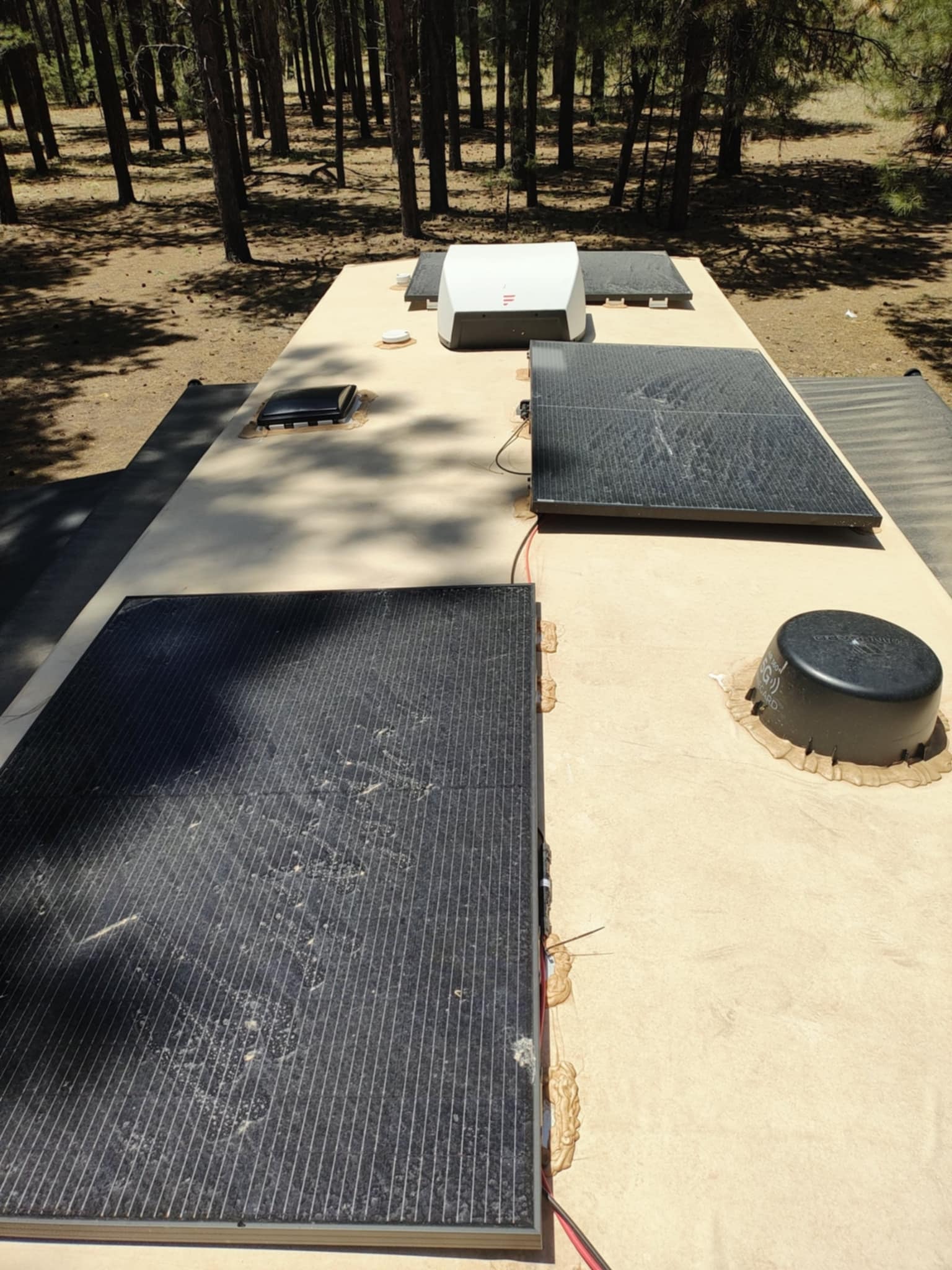 Close-up of solar panels on the Brinkley Z3400 roof in the forest