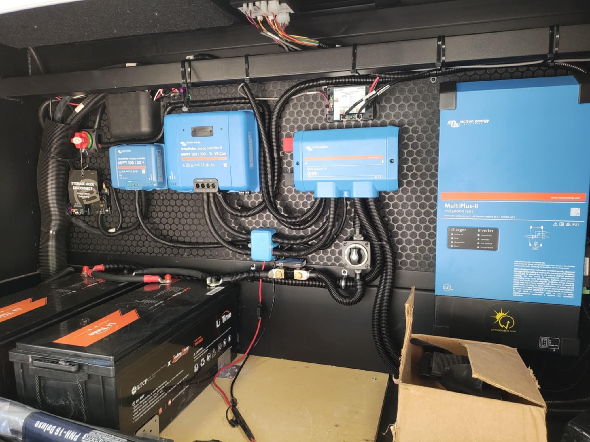Full Victron power system installed in the Brinkley Z3400 basement — SmartSolar charge controllers, Lynx Power In, MultiPlus-II inverter/charger, and LiTime batteries