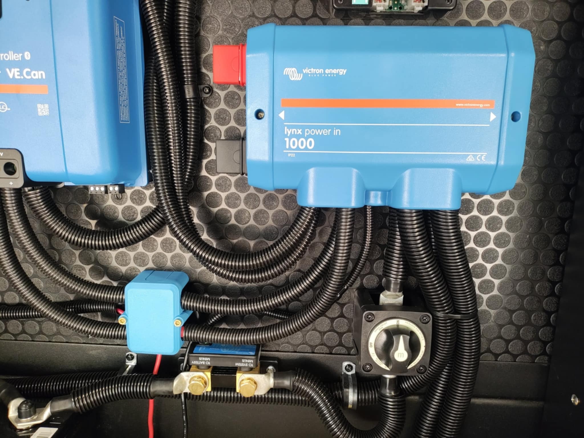 Victron Lynx Power In 1000 and SmartSolar charge controller close-up in the Brinkley Z3400 basement